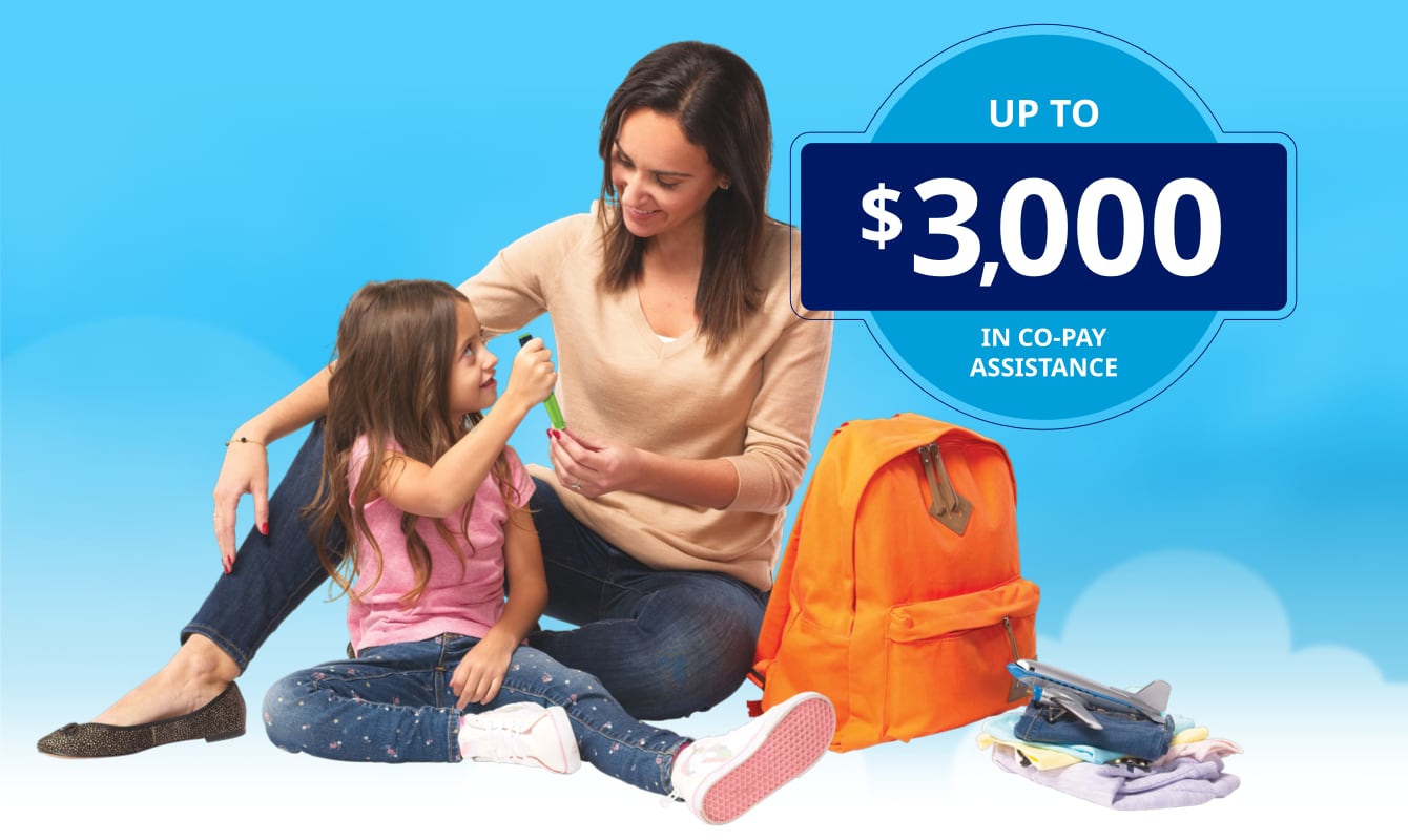 Photograph of a woman and girl smiling at each other and holding a growth-hormone applicator.