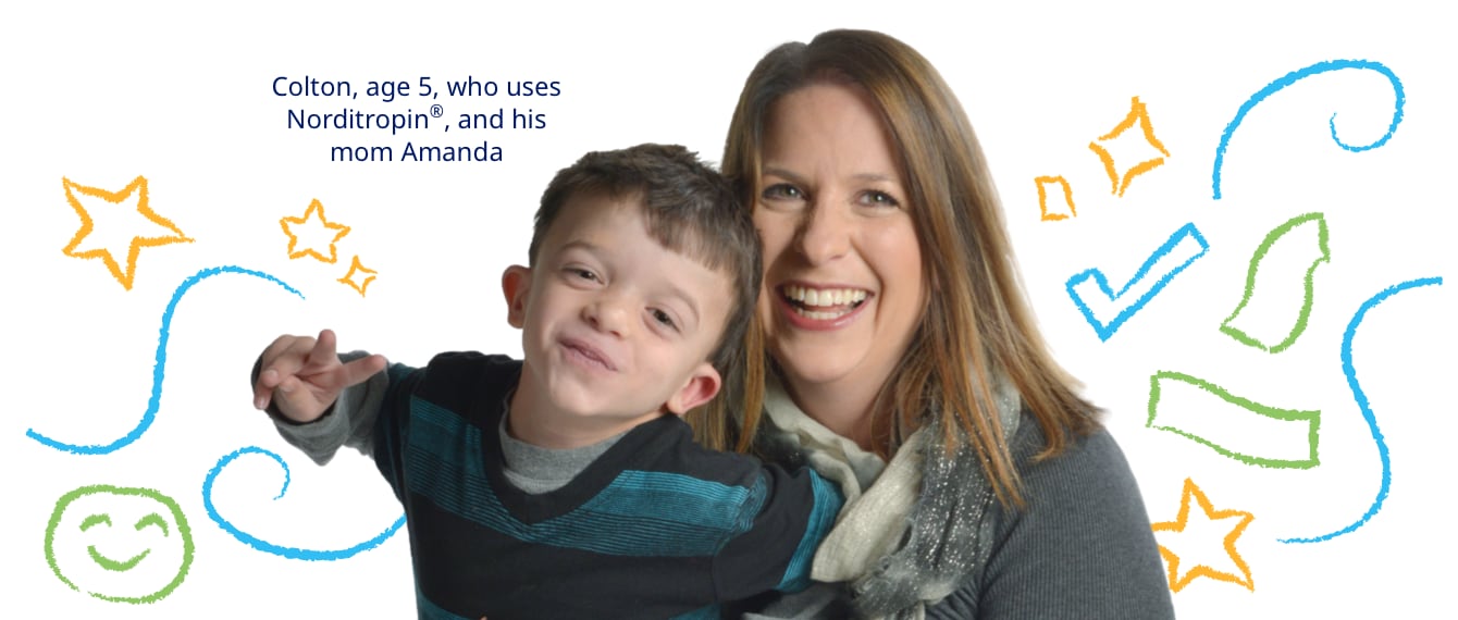 photo of a cheerful mother and son against a background of stars and other markings in crayon
