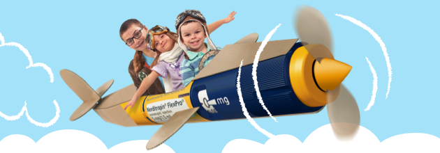 Three young kids sit in the cockpit of a &lsquo;plane&rsquo; that is actually a giant FlexPro&reg; pen with propellor.