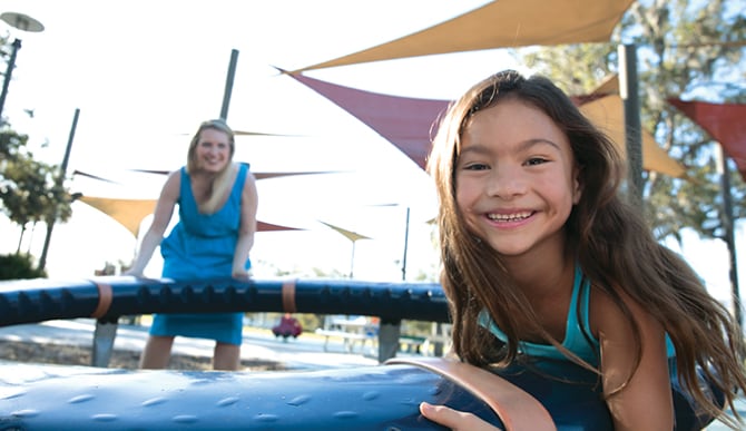 Photo of Emmy, age 7, who uses Norditropin®, and her mom.