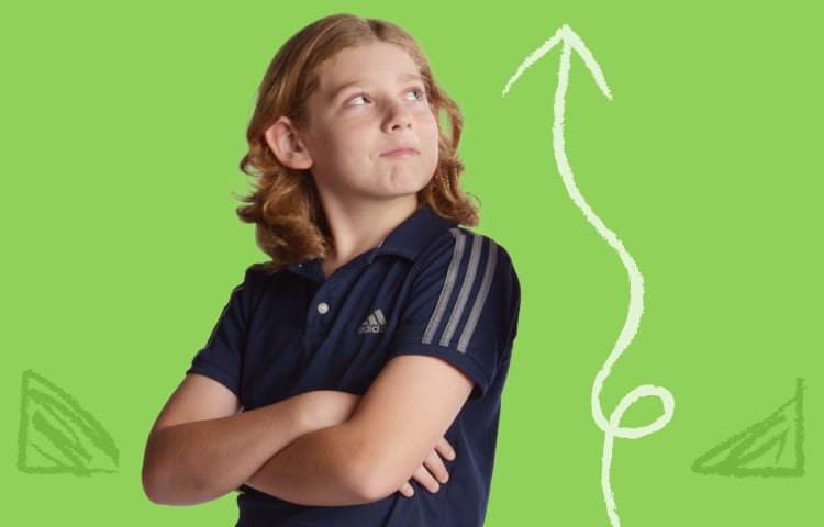 Photo of a young boy grinning and looking upward, next to an arrow pointing the same direction.